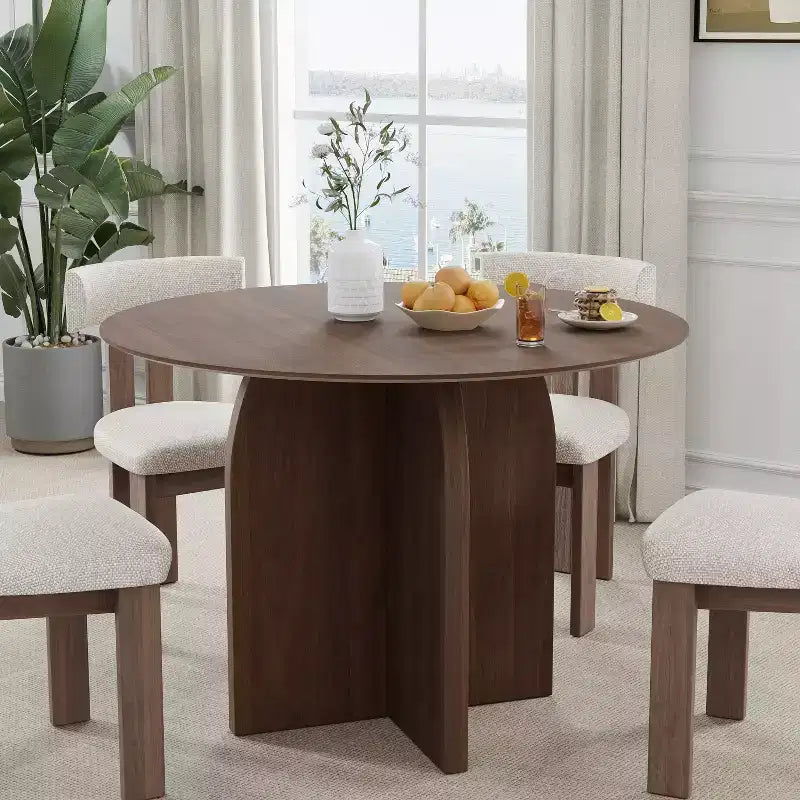 Table de salle à manger ronde en bois massif avec finition noyer et pieds arqués pour salles à manger et cuisines modernes